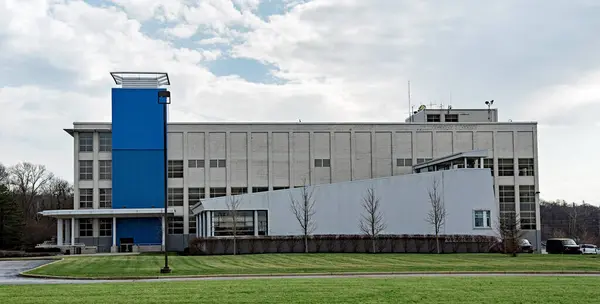Large Factory Building Blue Accent Stock Photo