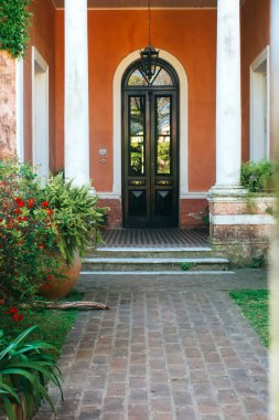 beautiful house with columns in daytime