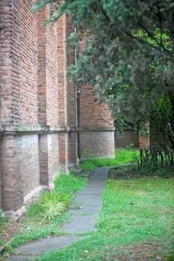 Path near old brick wall of building