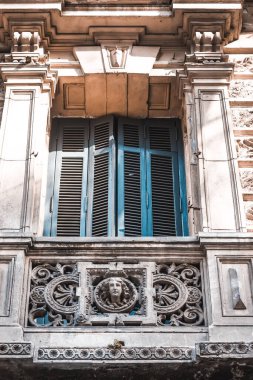 Window and balcony of old house