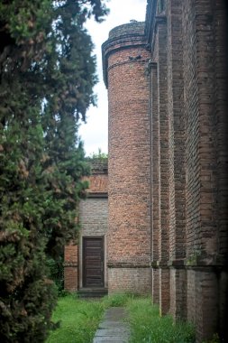 old brick castle with green yard