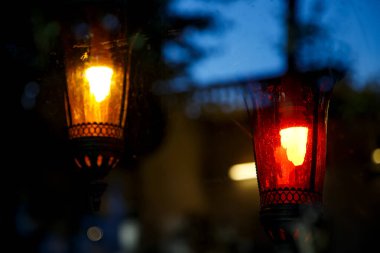 Glowing street lamps in dark city