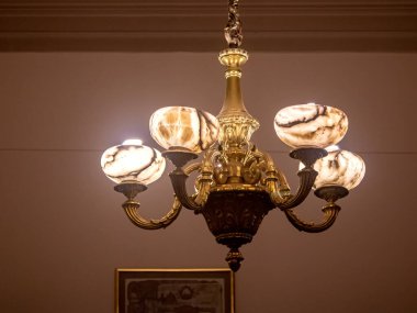 Glowing vintage chandelier on the ceiling