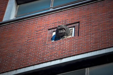 Brick building with statue on facade