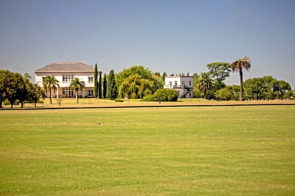 stock image Beautiful landscape of meadow and suburbia houses