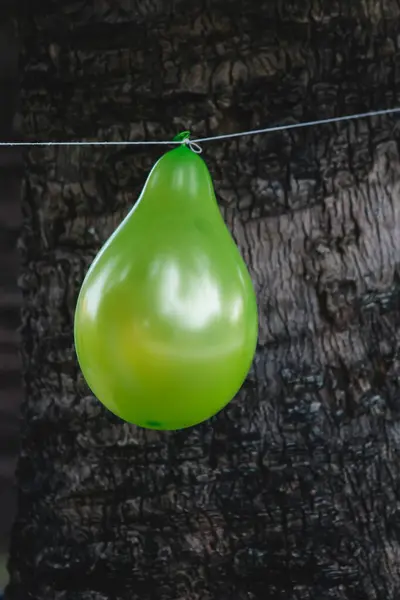 green balloon on rope