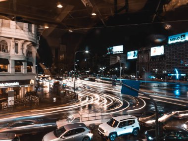 BUENOS AIRES, ARGENTINA - April 13, 2022: Street scene with architecture, transport and people 