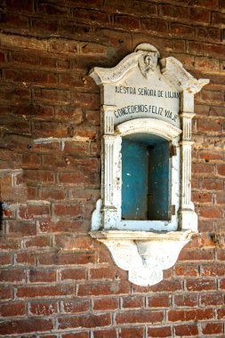 antique window on red brick facade of Rio Tala train station in Argentina, Estacion Rio Tala clipart