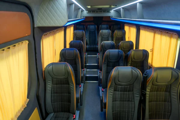 Stock image comfortable passenger bus interior with upholstered seats