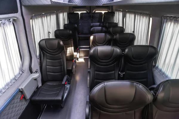 bus for travel or long transportation; comfort and safety of passengers on the road; individual transfer for a group of people; conversion of the interior of a truck; comfortable passenger bus interior with upholstered seats