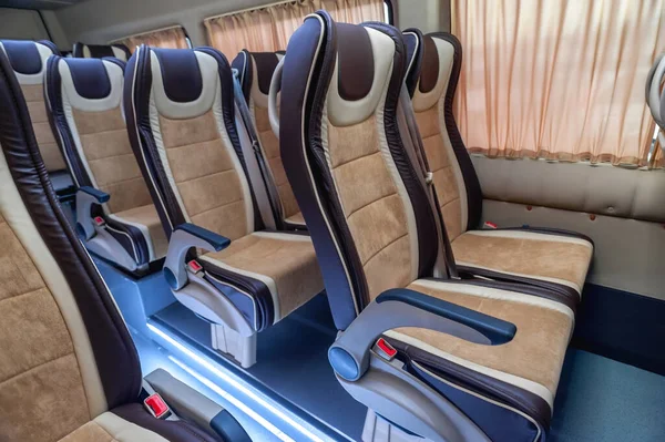 bus for travel or long transportation; comfort and safety of passengers on the road; individual transfer for a group of people; conversion of the interior of a truck; comfortable passenger bus interior with upholstered seats