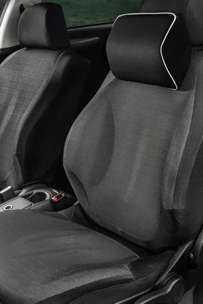 A soft pillow for the lower back and neck in the car. Orthopedic devices in the car. Means for the driver's health. A pillow on the driver's seat.