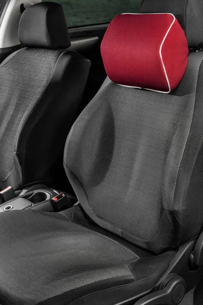 A soft pillow for the lower back and neck in the car. Orthopedic devices in the car. Means for the driver's health. A pillow on the driver's seat.