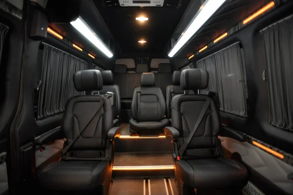 Comfortable interior of a passenger bus with soft seats. The design is made to order. Private covering of cars. Various elements of the bus interior.