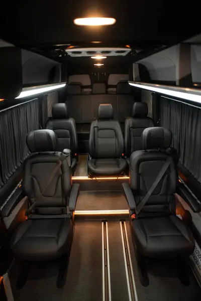 Comfortable interior of a passenger bus with soft seats. The design is made to order. Private covering of cars. Various elements of the bus interior.