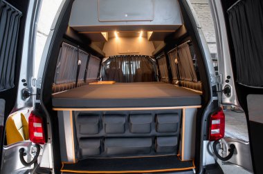 Comfortable interior of a passenger bus with soft seats. The design is made to order. Private covering of cars. Various elements of the bus interior.