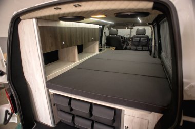 Comfortable interior of a passenger bus with soft seats. The design is made to order. Private covering of cars. Various elements of the bus interior.