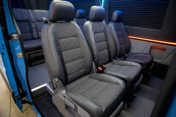 Comfortable interior of a passenger bus with soft seats. The design is made to order. Private covering of cars. Various elements of the bus interior.