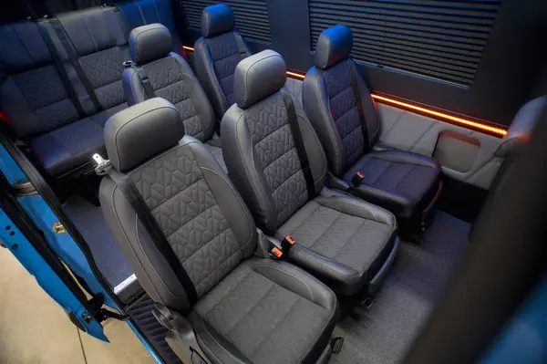Comfortable interior of a passenger bus with soft seats. The design is made to order. Private covering of cars. Various elements of the bus interior.