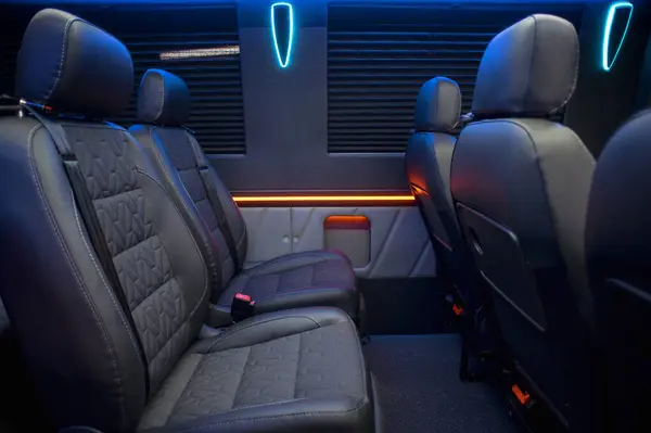 Comfortable interior of a passenger bus with soft seats. The design is made to order. Private covering of cars. Various elements of the bus interior.