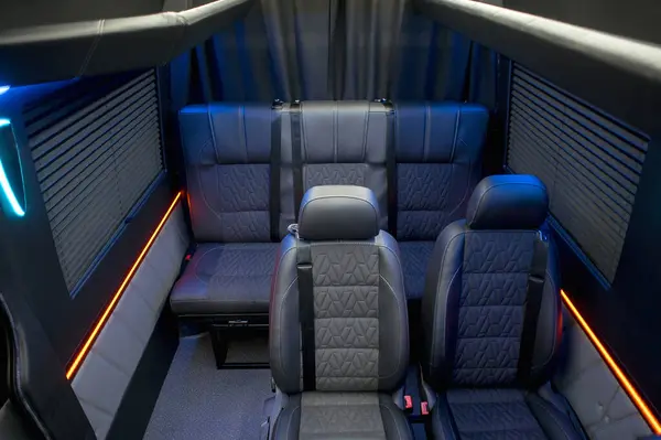 Comfortable interior of a passenger bus with soft seats. The design is made to order. Private covering of cars. Various elements of the bus interior.