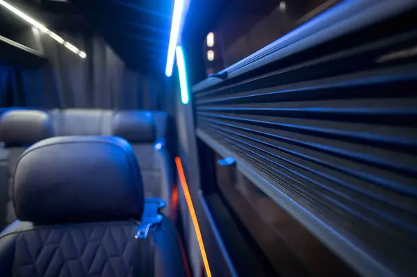 Comfortable interior of a passenger bus with soft seats. The design is made to order. Private covering of cars. Various elements of the bus interior.
