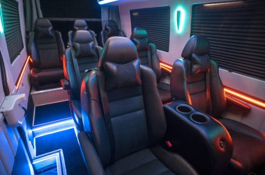 Comfortable interior of a passenger bus with soft seats. The design is made to order. Private covering of cars. Various elements of the bus interior.