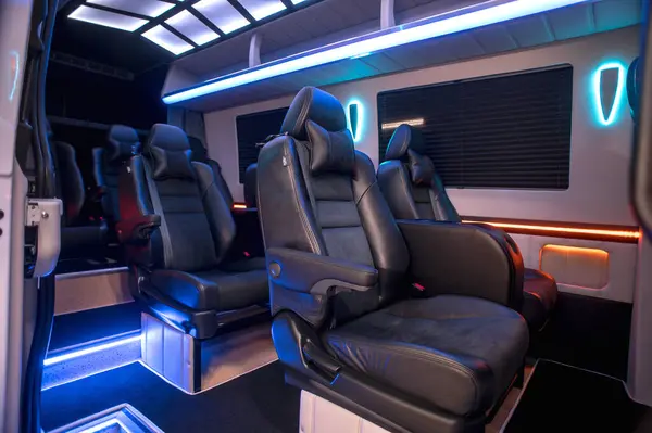 Comfortable interior of a passenger bus with soft seats. The design is made to order. Private covering of cars. Various elements of the bus interior.