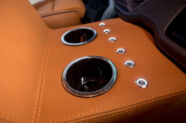 Comfortable interior of a passenger bus with soft seats. The design is made to order. Private covering of cars. Various elements of the bus interior.