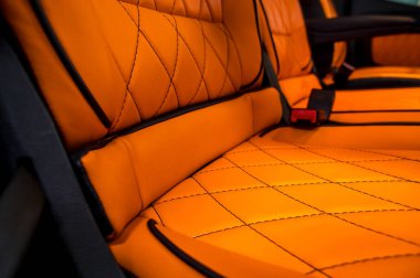 Comfortable interior of a passenger bus with soft seats. The design is made to order. Private covering of cars. Various elements of the bus interior.