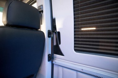 Comfortable interior of a passenger bus with soft seats. The design is made to order. Private covering of cars. Various elements of the bus interior.