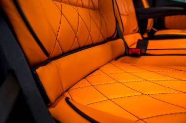 Comfortable interior of a passenger bus with soft seats. The design is made to order. Private covering of cars. Various elements of the bus interior.