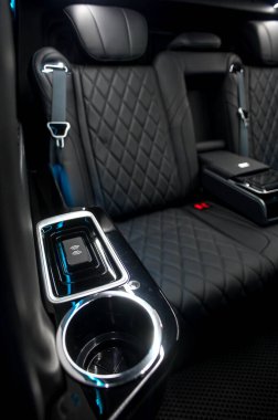Comfortable interior of a passenger bus with soft seats. The design is made to order. Private covering of cars. Various elements of the bus interior.