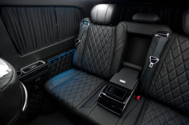 Comfortable interior of a passenger bus with soft seats. The design is made to order. Private covering of cars. Various elements of the bus interior.