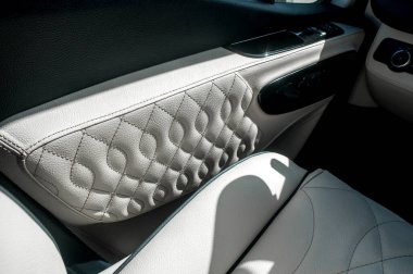 Comfortable interior of a passenger bus with soft seats. The design is made to order. Private covering of cars. Various elements of the bus interior.