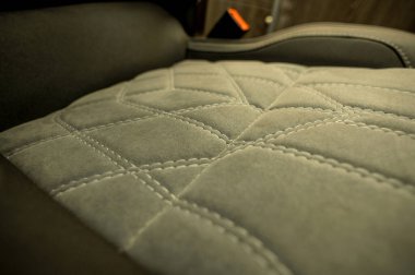 Comfortable interior of a passenger bus with soft seats. The design is made to order. Private covering of cars. Various elements of the bus interior.