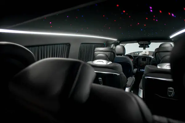 Comfortable interior of a passenger bus with soft seats. The design is made to order. Private covering of cars. Various elements of the bus interior.