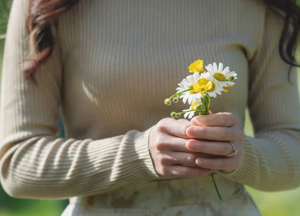 Close Woman Holding Flowers Stock Photo