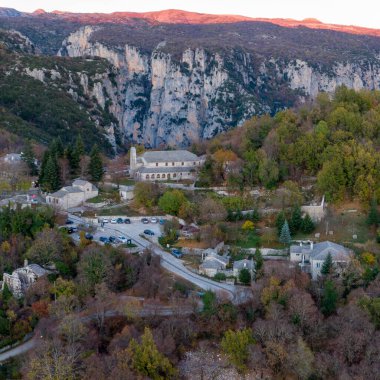 Aerial drone view of Traditional stone building in Monodendri village, Zagori Greece, Vikos Gorge national park in Vikos-Aoos in northern Greece. clipart