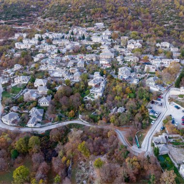 Aerial drone view of Traditional stone building in Monodendri village, Zagori Greece, Vikos Gorge national park in Vikos-Aoos in northern Greece. clipart