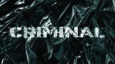 Beton bir arka planda siyah boyayla yazılmış suç kelimesi