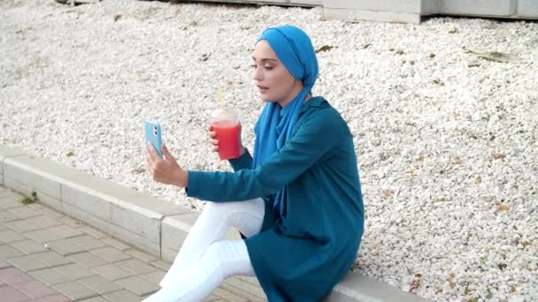 Young Muslim Woman Talking Video Call Outdoors — Stock Video