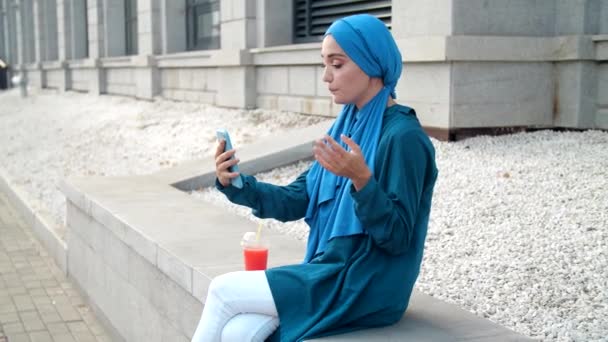 Young Muslim Woman Talking Video Call Outdoors — Stock Video