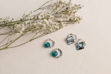 Handmade jewelry on a textile background. Gift for women. Bijouterie and jewellery for a women