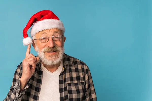 stock image Portrait of happy Santa Claus excited looking at camera and holds small christmas tree