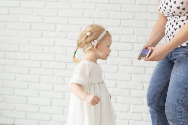 Child with cochlear implant hearing aid - deafness treatment medical innovative technologies