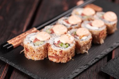 Salmon sushi roll with tuna flakes - sushi asian menu and Japanese food.