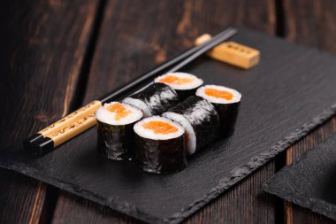 Maki sushi rolls with smoked salmon - Sushi menu. Japanese food