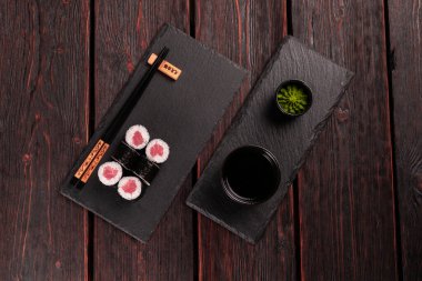 Maki sushi rolls with smoked salmon - Sushi menu. Japanese food
