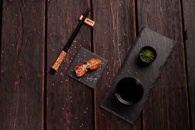 Japanese sushi unagi nigiri sushi eel on wooden background.
